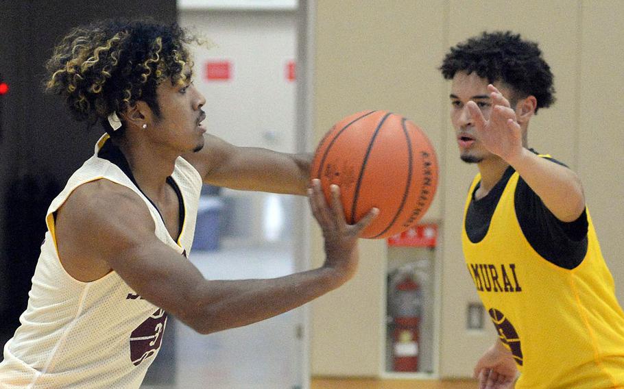 Seniors Denzel Gray and Roy Clayton line up at guard for Matthew C. Perry boys basketball after they played football for the Samurai.