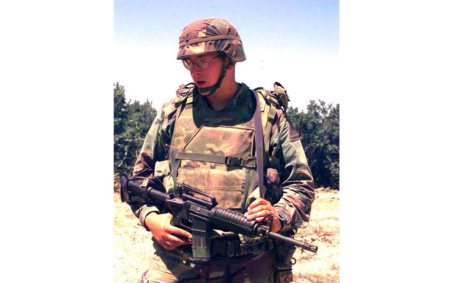 1st Lt. John Huzince, with Task Force Falcon, 1st Battalion, 36th Regiment, on watch at Checkpoint Sapper, Kosovo, July 6, 2000.