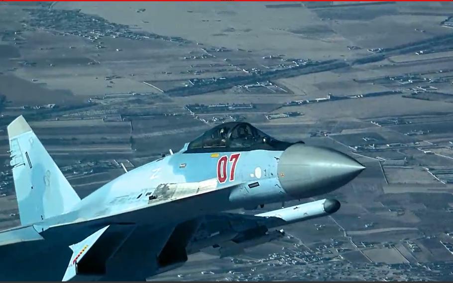 A Russian fighter plane flies close to a U.S. MQ-9 Reaper drone in Syria on July 23, 2023, in an image released by the U.S. Air Force. Flares launched by the jet struck the drone, severely damaging its propeller. Despite the damage, the aircraft was able to return to base.