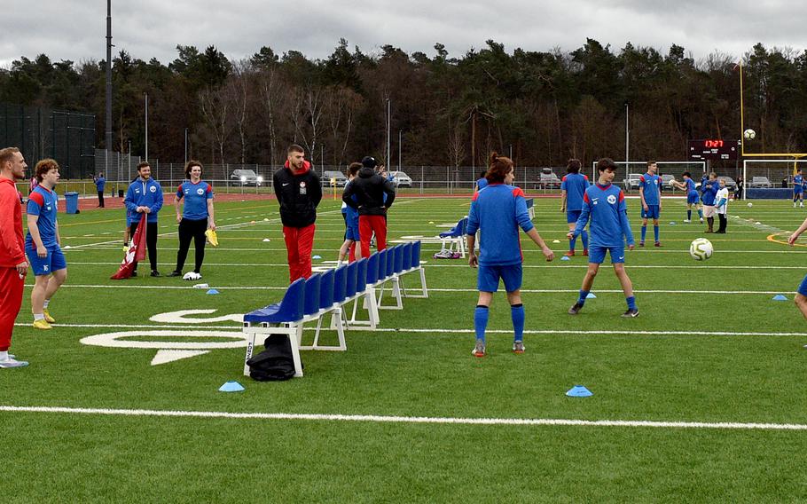 1. FC Kaiserslautern players compete in a foot tennis drill with Ramstein High School soccer players on March 23, 2023, at Ramstein Air Base, Germany.