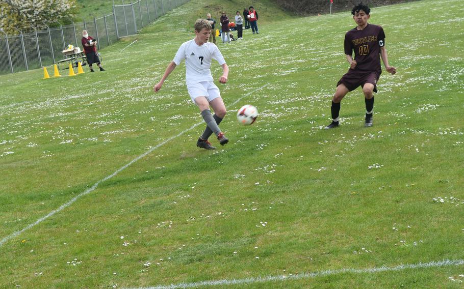 Ansbach's Benjamin Schuck attempts to pass the ball while Baumholder's Antonio Robles defends on Saturday, April 23, 2022 during a soccer match in Baumholder, Germany.