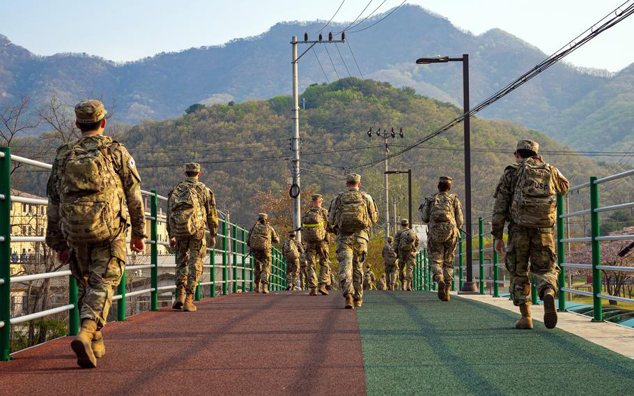 U.S. and South Korea troops take part in a ruck march at Camp Casey, South Korea, April 22, 2022. 