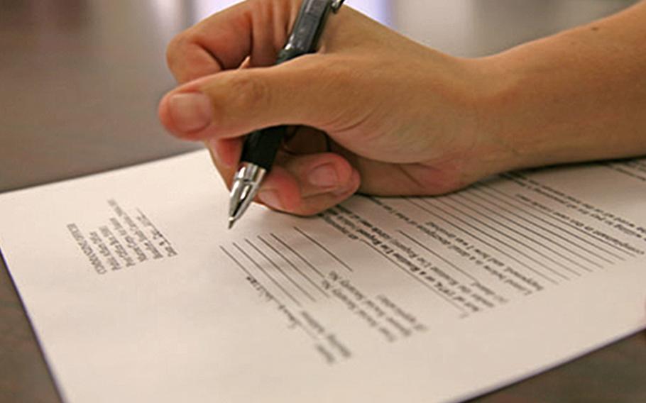 A Marine fills out a Freedom of Information Act request example at Marine Corps Air Station Beaufort. The Department of Defense along with the Navy, Marines and U.S. Central Command are being sued for violating the act, which allows people to obtain public records from the federal government.