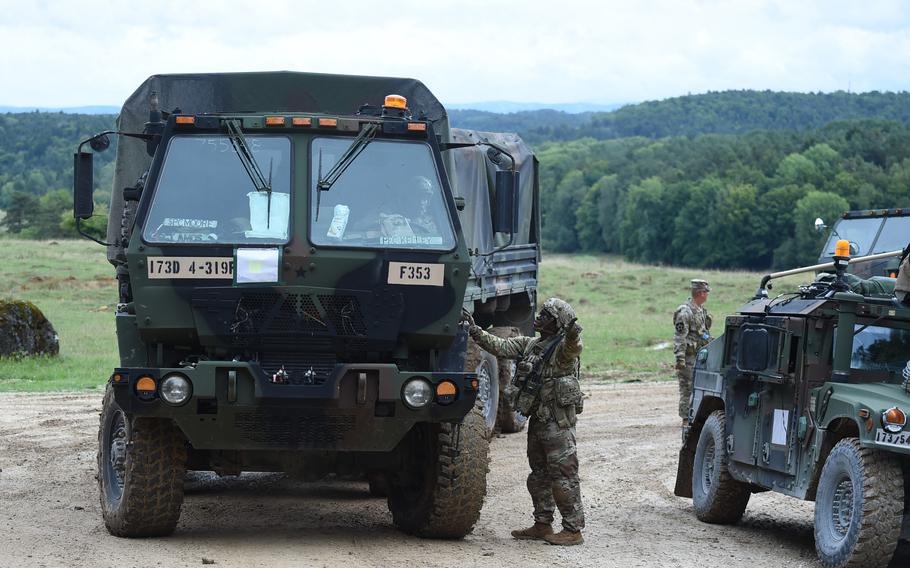 Soldiers prepare for an aerial drop of heavy equipment at the Hohenfels Training Area in Germany, Sept. 8, 2022. Soldiers had to adapt to changing weather conditions while awaiting the drop.