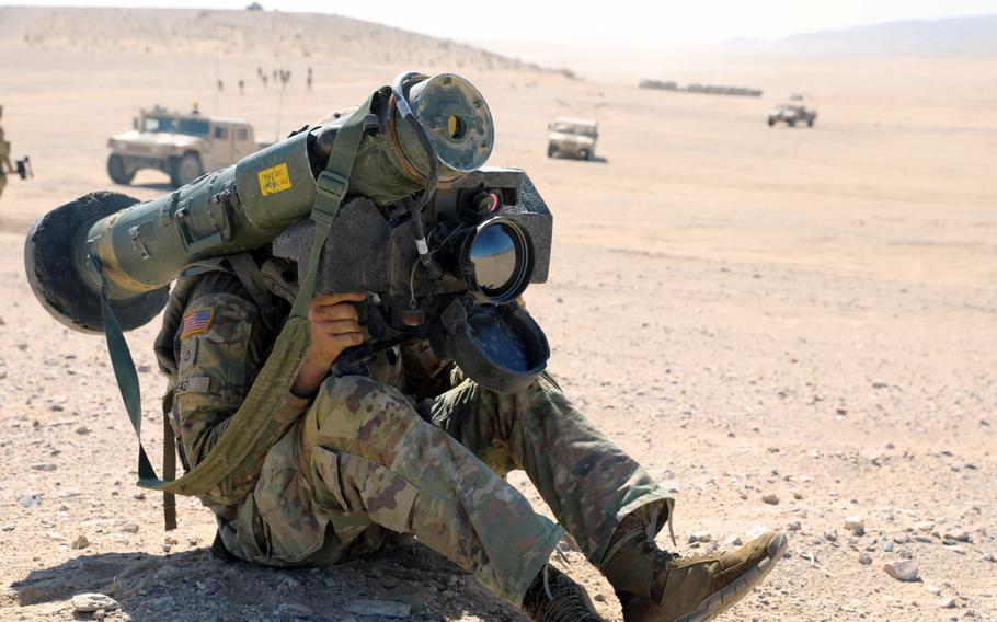 A member of the Mississippi Army National Guard prepares to fire a Javelin anti-tank missile at the National Training Center in Fort Irwin, Calif., June 12, 2021. 