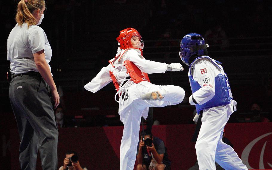 Afghan Taekwondo athlete Zakia Khudadadi, in red, takes on Uzbek Ziyodakhon Isakova during the Tokyo Paralympics in Chiba prefecture, Japan, Thursday, Sept. 2, 2021. 