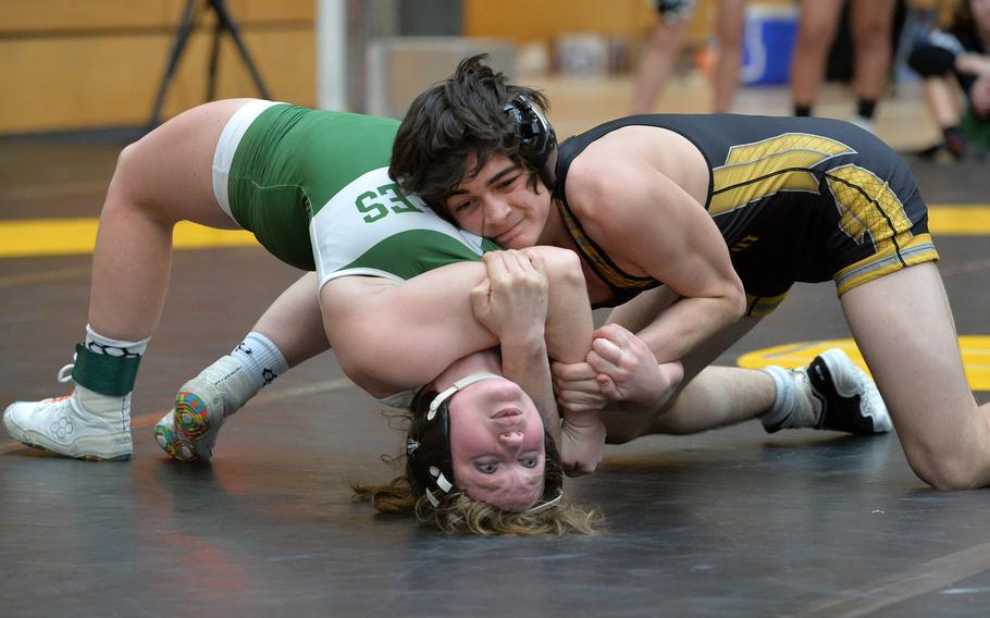 Audrey Pounds of Naples struggles to get out of the grip of Stuttgart’s Julian Licata in a 138-pound match at the DODEA-Europe wrestling finals in Wiesbaden, Germany, Feb. 10, 2023.