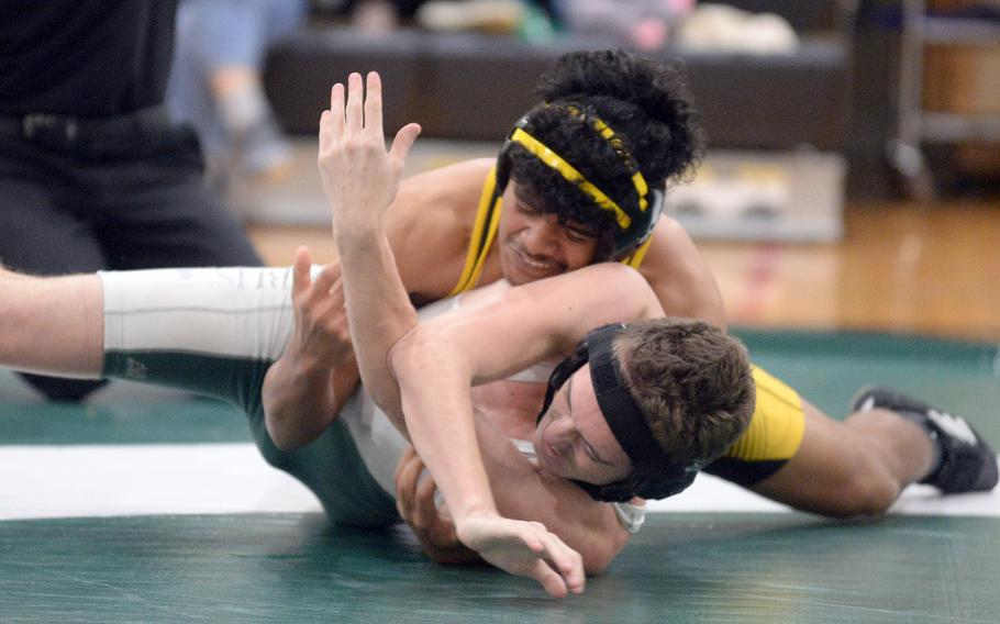 Kadena's Kai Cristy gains the upper hand on Kubasaki's James Fordham at 168 pounds during Wednesday's Okinawa wrestling dual meet. Cristy outlasted Fordham by technical fall 21-10 in 6 minutes and the Panthers won the meet 30-27.