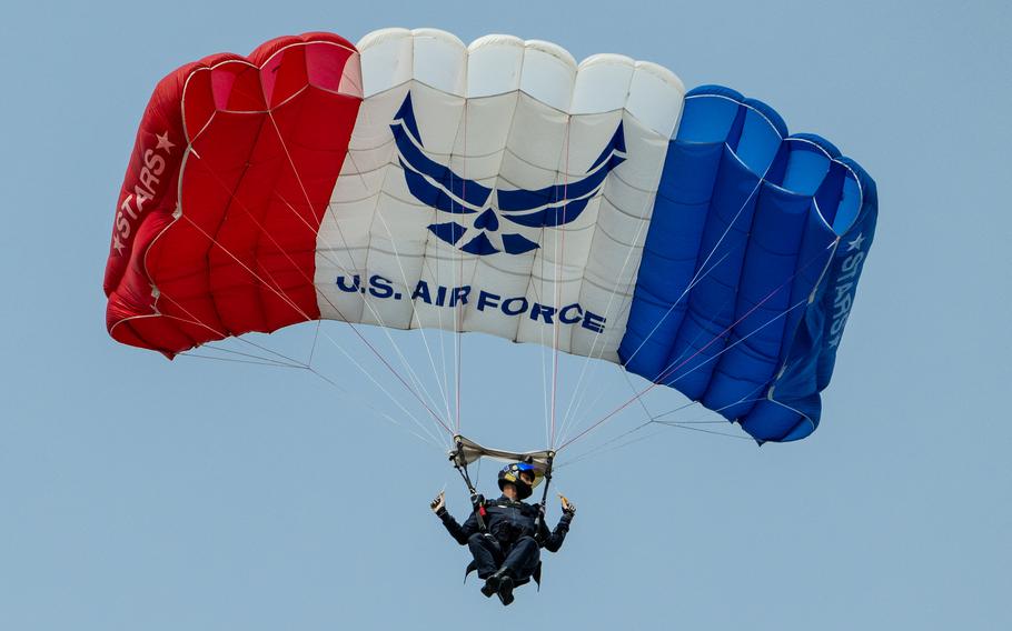 An airman from the U.S. Air Force Academy Wings of Blue demo team parachutes into Slugger Field during the Thunder Over Louisville air show in Louisville, Ky., Saturday, April 20, 2024.