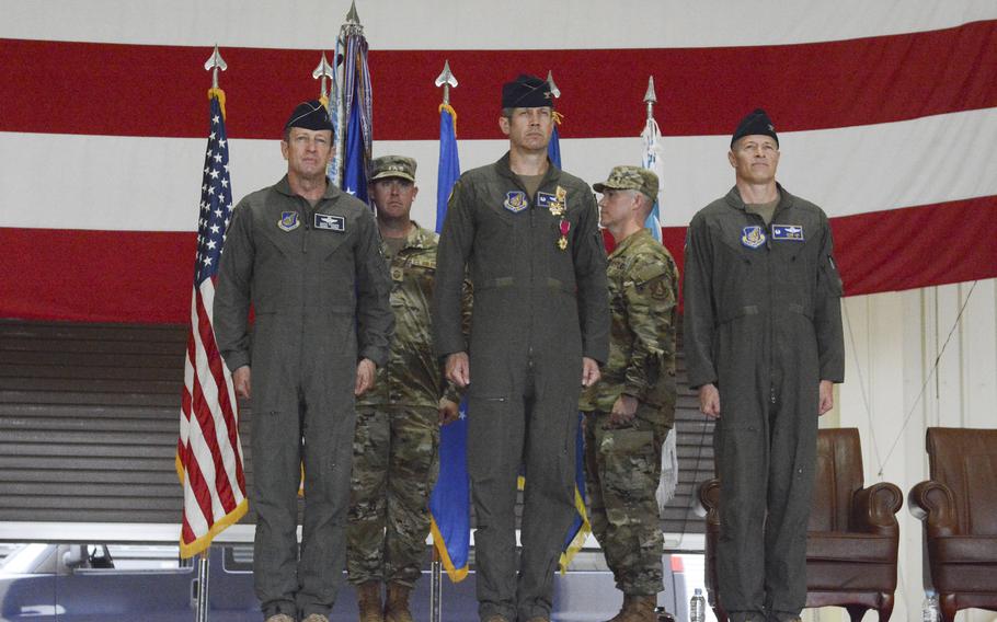 Air Force Lt. Gen. David Iverson, deputy commander of U.S. Forces Korea, stands on a stage alongside outgoing 51st Fighter Wing commander Col. William McKibban, and incoming commander Col. Ryan Ley at Osan Air Base, South Korea, June 27, 2025.