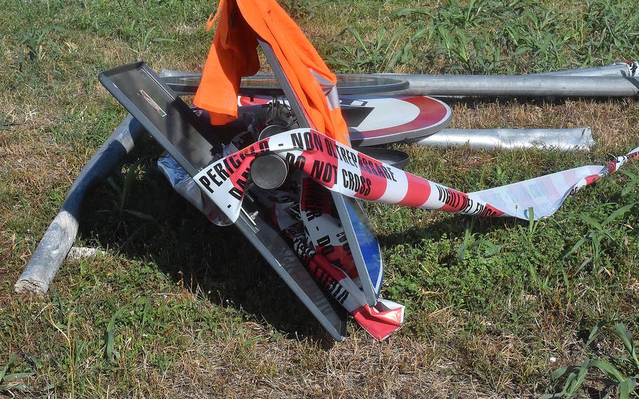 Mangled signs and caution tape remained on Aug. 22, 2022 at the scene of a fatal accident where a car driven by an American airman veered off the road Sunday and killed an Italian teenager walking in the bicycle lane at a roundabout in the town of Sant' Antonio, according to Italian media reports.

Kent Harris/Stars and Stripes