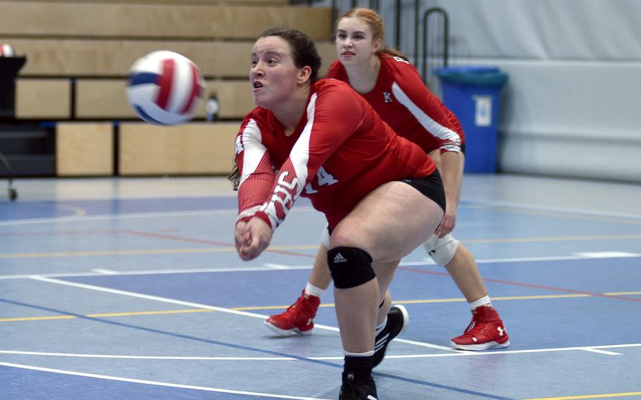 Kaiserslautern's Sage Barnes, foreground, goes for a dig during pool-play action at the DODEA European volleyball championships on Thursday at Ramstein High School at Ramstein Air Base, Germany. Piper Nowlin follows in the background.

Matt Wagner/Stars and Stripes