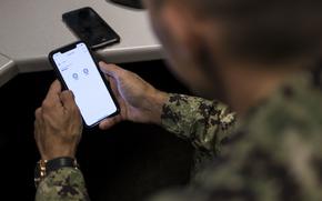 190719-N-VS214-0055 MILLINGTON, Tenn. (July 07, 2019) Chief Navy Counselor Grant Khanbalinov uses his phone to create a new post on Reddit. (U.S. Navy photo by Mass Communication Specialist 2nd Class Zachary S. Eshleman/Released)