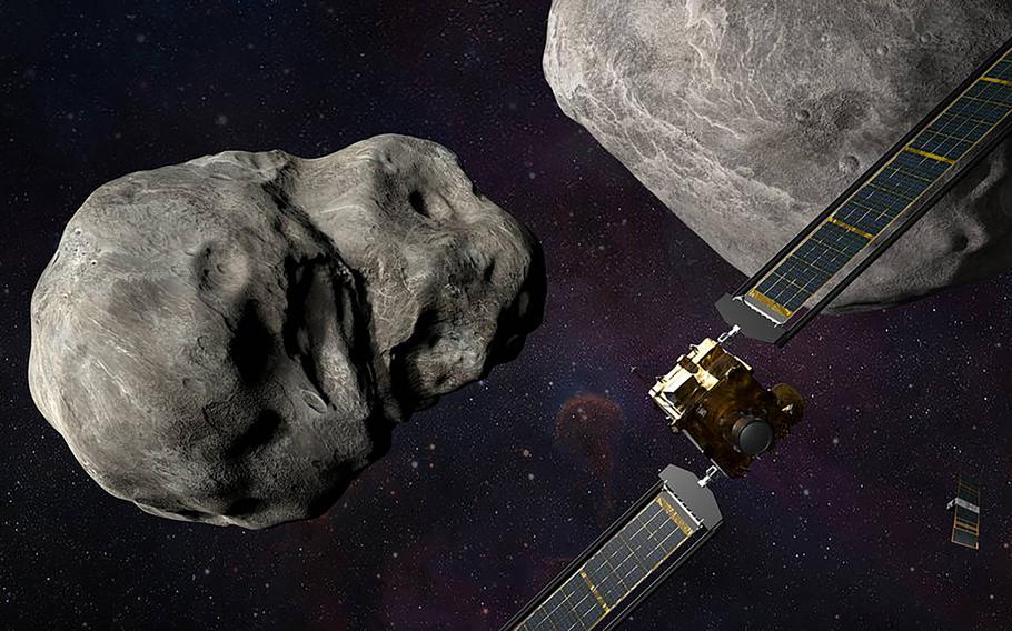 A NASA illustration shows the agency's Double Asteroid Redirection Test (DART) spacecraft before making impact with an asteroid. MUST CREDIT: NASA/Johns Hopkins, APL/Steve Gribben.