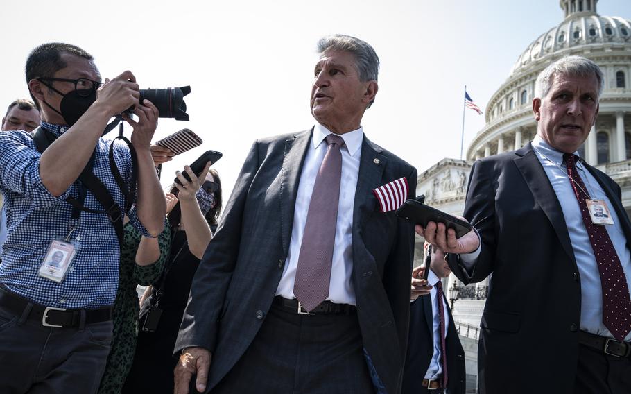 Sen. Joe Manchin, D-W.Va., speaks with reporters on Capitol Hill on Sept. 13, 2021, in Washington. 