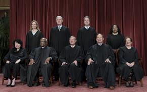 Members of the Supreme Court sit for a new group portrait following the addition of Associate Justice Ketanji Brown Jackson, at the Supreme Court building in Washington, on Oct. 7, 2022. Bottom row, from left, Associate Justice Sonia Sotomayor, Associate Justice Clarence Thomas, Chief Justice of the United States John Roberts, Associate Justice Samuel Alito, and Associate Justice Elena Kagan. Top row, from left, Associate Justice Amy Coney Barrett, Associate Justice Neil Gorsuch, Associate Justice Brett Kavanaugh, and Associate Justice Ketanji Brown Jackson. The core issue being debated before the Supreme Court on April 25, 2024, boils down to this: Whether a former president is immune from prosecution for actions taken while in office — and, if so, what is the extent of the immunity?
