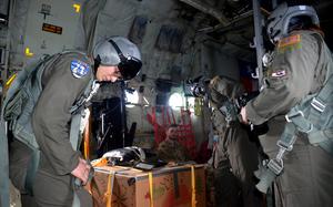 Airmen aboard a C-130J Super Hercules prepare to parachute donated Operation Christmas Drop supplies to the remote Eauripik islands in the Federated States of Micronesia, Wednesday, Dec. 7, 2022. 