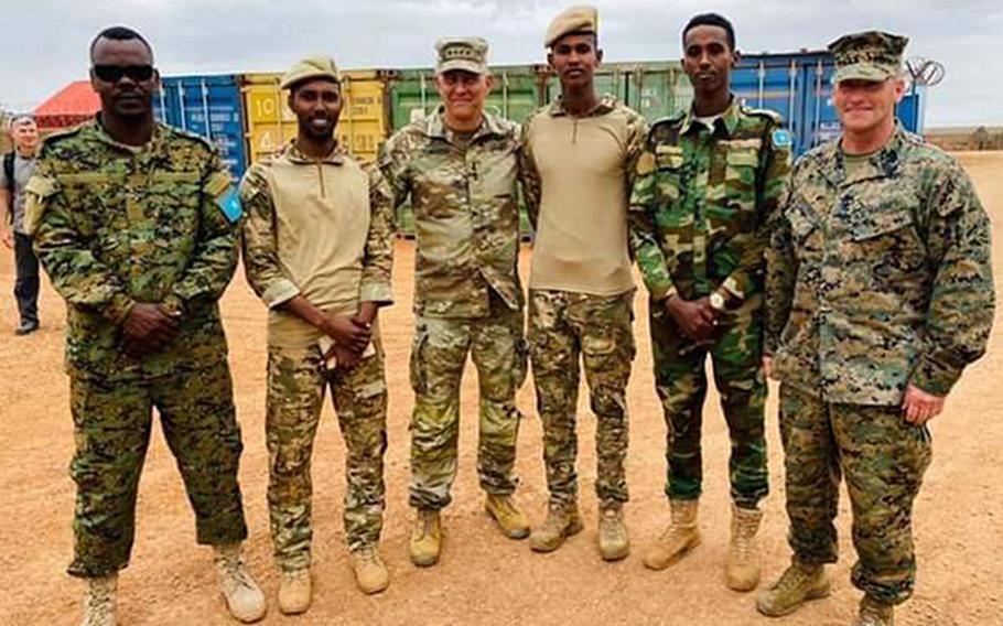 U.S. Africa Command’s Gen. Stephen Townsend, third from left, poses for a photo during a visit last week to a Somali military base 60 miles outside of Mogadishu in Baledogle, a site where U.S. forces came under attack in 2019. Townsend met with an elite Somali infantry unit. 