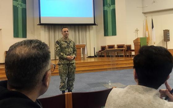 Dr. James Demitrack, a Navy captain in charge of Naval Family Branch Clinic Iwakuni, talks about space-available appointments for civilians during a town hall meeting at Marine Corps Air Station Iwakuni, Japan, Thursday, Jan. 12, 2023. 