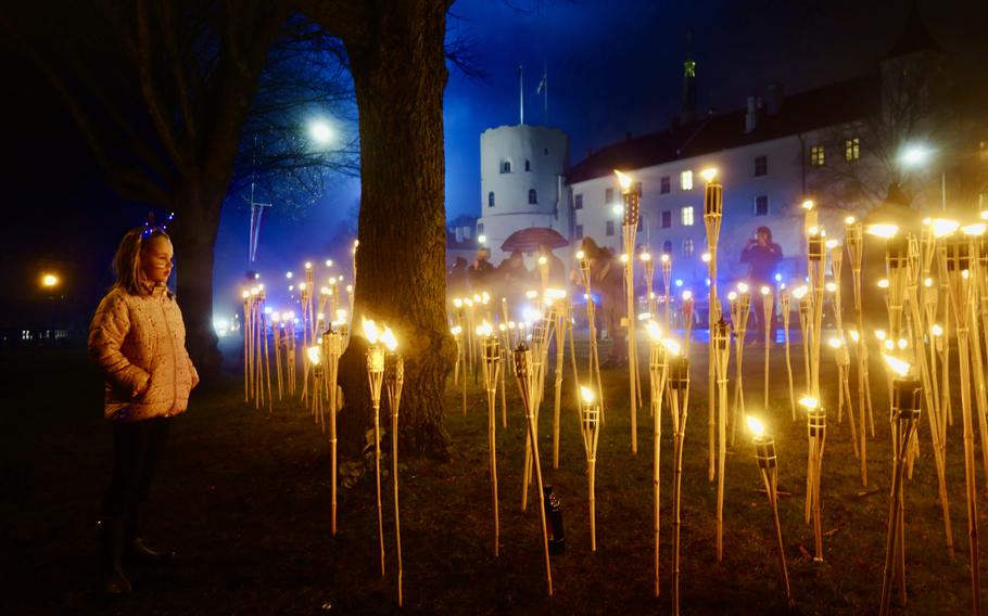 Latvians in Riga celebrate Lāčplēsis Day, or Freedom Fighters’ Remembrance Day, on Nov. 11, 2023, to mark the Latvian army’s victory over a joint Russian-Germany army during the Latvian War of Independence in 1919. After a torchlight procession, the torches are stuck in the ground.                 