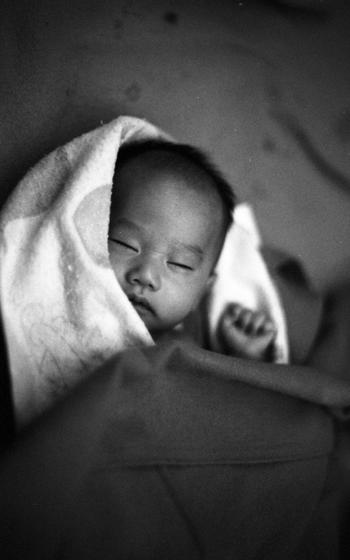 A sleeping infant seen from above.