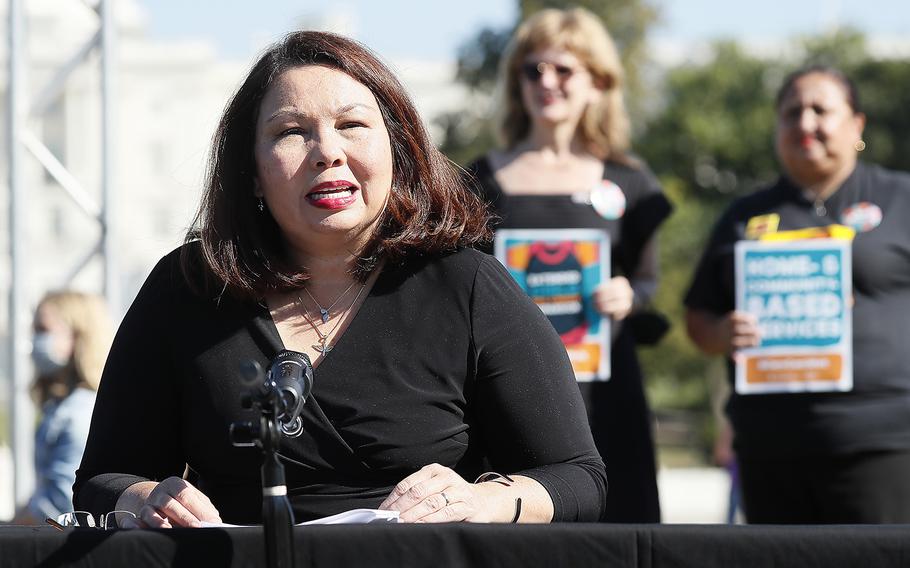 Sen. Tammy Duckworth (D-IL) along with members of Congress, parents and caregiving advocates hold a press conference supporting Build Back Better investments in home care, childcare, paid leave and expanded CTC payments in front of the U.S. Capitol Building on Oct. 21, 2021, in Washington, D.C.