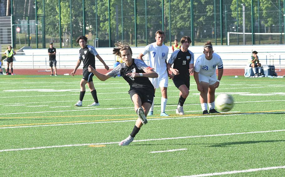 Stuttgart captain Andrew Wagner scores the first goal of the game on a penalty kick Wednesday, May 18, 2022, at the DODEA-Europe boys Division I soccer semifinals at Ramtein Air Base, Germany.