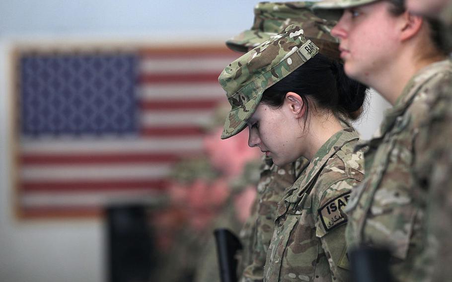 Oklahoma National Guard soldier Pfc. Sarah Bartodei, 19, and fellow soldiers gather to receive their combat action patches on the anniversary of the Sept. 11, 2001, terrorist attacks on Sept. 11, 2011, at Bagram Air Field, Afghanistan. 