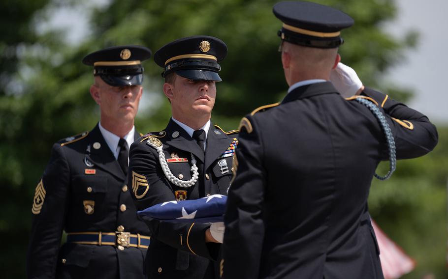 U.S. Army Honor Guard members Sgt. Major Peter Moeller, Staff Sgt. Devin Hilgenberg, and Staff Sgt. Dylan Benischek participate in a flag folding ceremony at the Iowa Veterans Cemetery.