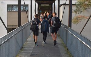Students head to class at a Department of Defense Education Activity school in Germany in 2024. An executive order signed April 23, 2025, by President Donald Trump directs U.S. public schools, including those operated by DODEA, to end discipline policies based on racial considerations and instead make student behavior the standard.