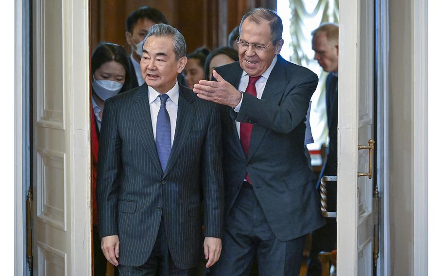 Russian Foreign Minister Sergey Lavrov, right, and the Chinese Communist Party’s foreign policy chief Wang Yi enter a hall for their talks in Moscow, Russia, Wednesday, Feb. 22, 2023.