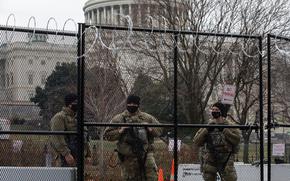 Michigan National Guardsmen with the 210th Military Police Battalion secure a gate at the U.S. Capitol in Washington, Feb. 15, 2021. Rioters stormed the Capitol about a month earlier, including some veterans who were later charged and sentenced for their actions. 