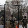 Michigan National Guardsmen with the 210th Military Police Battalion secure a gate at the U.S. Capitol in Washington, Feb. 15, 2021. Rioters stormed the Capitol about a month earlier, including some veterans who were later charged and sentenced for their actions. 