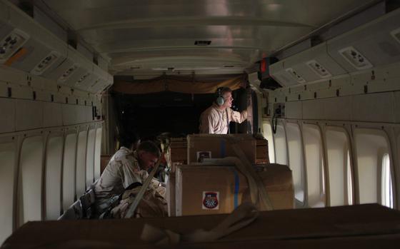 Hed: Sherpas deliver, 2004

Balad Air Base, Iraq: Oct. 13, 2004: Sgt. Eric Muse, flight engineer with Company H of the 171st Aviation Regiment, at Balad Air Base, Iraq, looks out the rear door before takeoff in the C-23 Sherpa. The plane is ideal for carrying mid-sized loads of cargo and passengers in Iraq. The speed and low flights mean that by the time the enemy sees the plane, it's gone.

Read the original 2004 article on the Sherpas here.https://www.stripes.com/news/2004-10-20/c-23-sherpa-the-aircraft-that-can-in-iraq-2021499.html1

META TAGS: C-23; H Company, 171st Aviation Regiment; Army National Guard; aircraft; sherpa