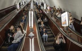 People take cover at a metro station during a Russian rocket attack in Kyiv, Ukraine, Monday, May 29, 2023.  (AP Photo/Evgeniy Maloletka)