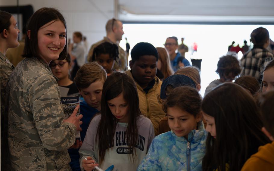A Civil Air Patrol member speaks to students during the Student Engagement and Career Day event with one of the volunteers at Joint Base McGuire-Dix-Lakehurst, N.J., Friday, April 19, 2024. 