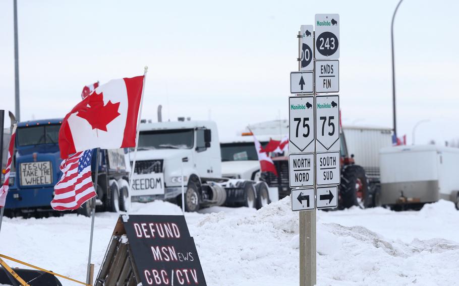Trucks blockade the U.S.-Canada border crossing during a demonstration in Emerson, Manitoba, Canada, on Feb. 13, 2022. 
