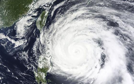 This Monday, May 29, 2023 satellite image released by NASA shows Typhoon Mawar approaching Philippines' northern provinces. 