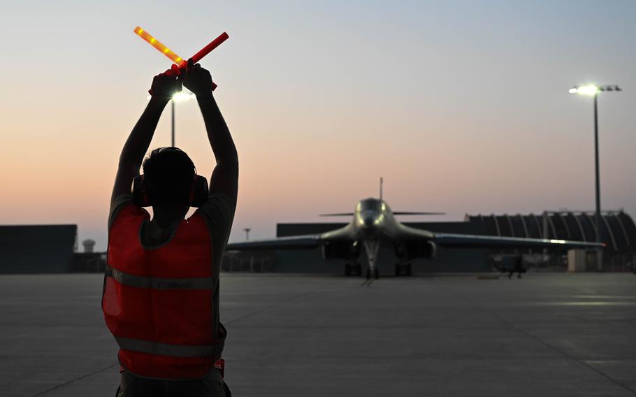 An aircrew member assigned to the 37th Aircraft Maintenance Unit directs a B-1B Lancer onto the runway at Ellsworth Air Force Base, S.D., on Aug. 29, 2023.