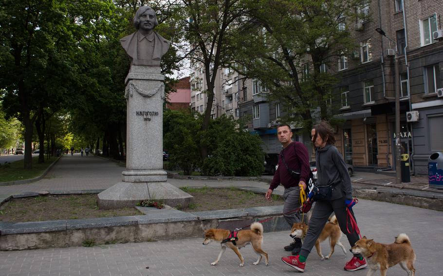 A statue of 19th-century novelist Nikolai Gogol overlooks one of the main boulevards in Dnipro, Ukraine.
