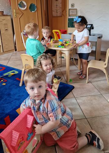 Children play under the care of Kenia Guijarro, a military spouse and family child care provider, Aug. 26, 2022, in Matzenbach, Germany.  Some U.S. military commands in Germany have encouraged spouses to open their own daycare businesses to alleviate the shortage of places available on bases. 