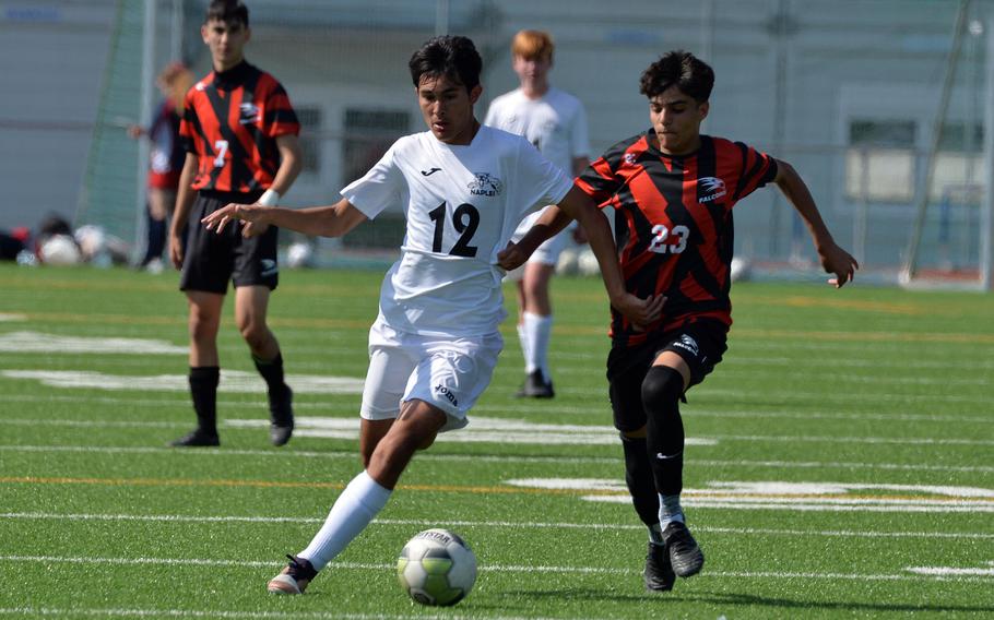 Naples’ Tommy Egan and American Overseas School of Rome’s Jacopo Giuffrida fight for the ball in the boys Division II final at the DODEA-Europe soccer championships in Ramstein, Germany, May 18, 2023.