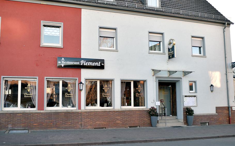 The red and white exterior of the Piemont Restaurant.