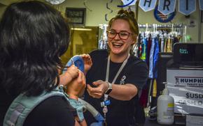 Humphreys Thrift Store head sales associate Rosie Faltus helps a customer in the shop at Camp Humphreys, South Korea, May 2, 2024.