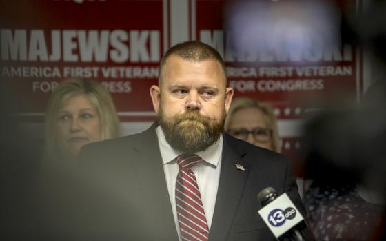 Ohio Republican congressional candidate J.R. Majewski defends his military record at a news conference Friday, Sept. 23, 2022, in Holland, Ohio. Majewski has campaigned  by presenting himself as an Air Force combat veteran who deployed to Afghanistan after the 9/11 terrorist attacks. Military documents obtained by The Associated Press through a public records request, indicate Majewski never deployed to Afghanistan but instead completed a six-month stint helping to load planes at an air base in Qatar, a longtime U.S. ally that is a safe distance from the fighting.