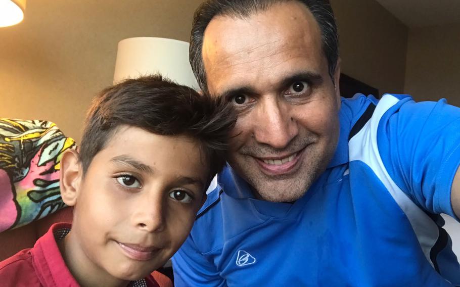 Noman Mujtaba, 10, and his adoptive father, Bahaudin Mujtaba, pose for a selfie Aug. 28, 2021, after being reunited in Virginia following Noman’s harrowing evacuation from Kabul, Afghanistan. The family was nearing the end of the adoption process when Kabul fell to the Taliban in mid-August.