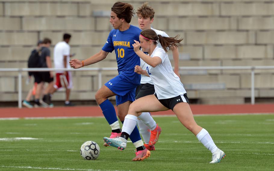 Brussels’ Tessa Wedekind fights Sigonella’s Santiago Rodriguez Albarca for the ball in a Division III semifinal at the DODEA-Europe soccer championships in Kaiserslautern, Germany, May 17, 2023. Sigonella defeated Brussels 6-0 to advance to the final.