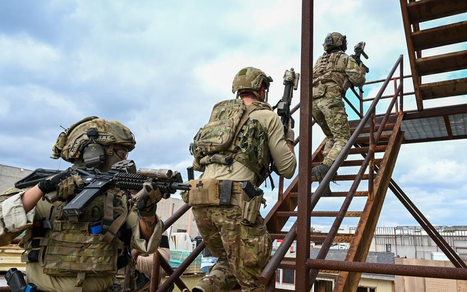 U.S. and South Korean navy SEALs enter a building during an assault exercise in Coronado, Calif., Dec. 1, 2022.