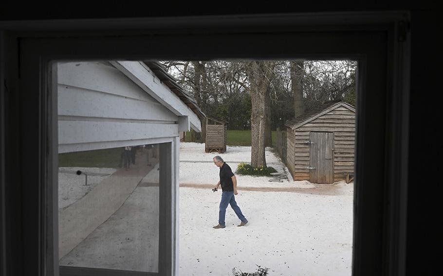 A visitor is seen framed in a portion of former president Jimmy Carter’s boyhood home. 