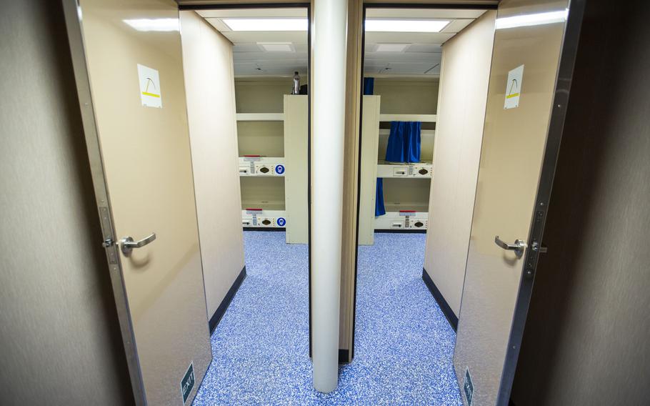 The entrance to some of the living quarters aboard the Auxiliary Personnel Lighter 68 housing barge docked at the Norfolk Naval Shipyard in Portsmouth, Va., on Nov. 21, 2022.